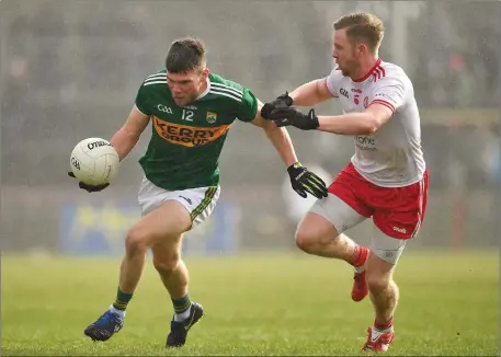  ?? Photo by Brendan Moran / Sportsfile ?? Kevin McCarthy of Kerry is tackled by Frank Burns of Tyrone during the Allianz Football League Division 1 Round 7 match between Tyrone and Kerry at Healy Park in Omagh, Tyrone