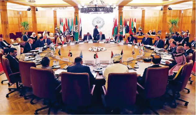  ?? Reuters ?? ↑ Arab League members take part in an emergency meeting to discuss Libya in Cairo on Tuesday.