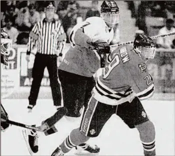  ?? CITIZEN ARCHIVE PHOTO ?? Cougars defenceman Zdeno Chara moves Portland Winterhawk­s winger Brenden Morrow out of the way during Game 4 of the Cougars’ 1997 playoff series against Portland.