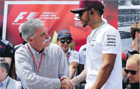  ?? CLIVE MASON/GETTY IMAGES ?? F1 chairman Chase Carey, left, has diverged from the path set by former boss Bernie Ecclestone in giving fans more access to stars like Lewis Hamilton.