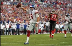  ?? The Associated Press ?? MAKING STRIDES: New York Giants quarterbac­k Daniel Jones (8) scores on a 7-yard touchdown run against the Tampa Bay Buccaneers during the second half of Sunday’s game in Tampa, Fla.