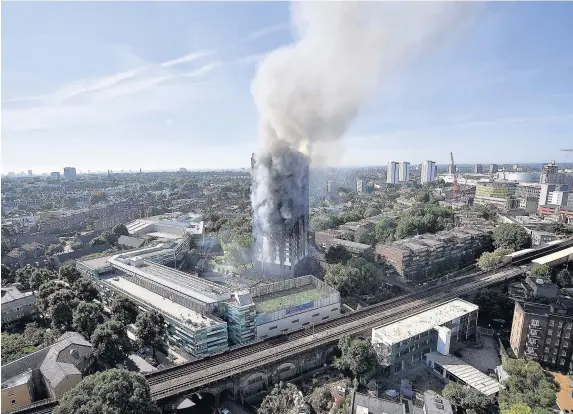  ?? Leon Neal ?? > Smoke rises from Grenfell Tower as the blaze became the latest in a stream of horrific news to hit our TVs, computers and smartphone­s