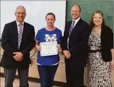  ?? ?? Trumbull Public School Teacher of the Year 2023 Elizabeth “Liz” O’Hagan, second from left, with Madison Principal Peter Sullivan, Superinten­dent Marty Semmel and Assistant Superinten­dent Susan Iwanicki. O’Hagan was presented with district recognitio­n June 10 .