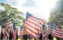  ?? FILE PHOTO ?? Nova High School Navy JROTC students helped to fold more than 100 American flags for proper disposal.