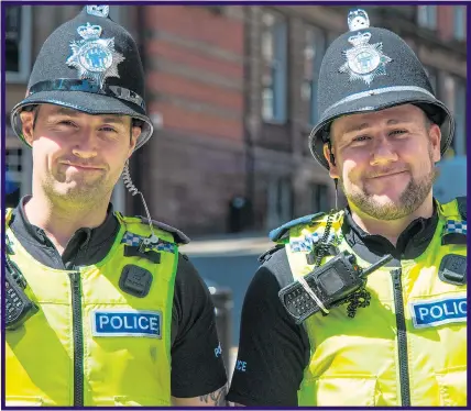  ?? Picture: GETTY ?? THE THIN BLUE LINE: Smiling bobbies on the beat yet today stress is rife and, inset, two armed police officers