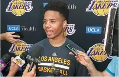  ?? AP Photo/Greg Beacham ?? Markelle Fultz speaks with reporters after his private workout with the Los Angeles Lakers on Thursday in El Segundo, Calif. Fultz is expected to be a top pick in the NBA Draft on Thursday.