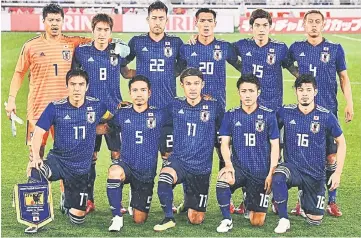  ?? — AFP photo ?? (Front row from left) Japan’s Makoto Hasebe, defender Yuto Nagatomo, midfielder Takashi Usami, midfielder Ryota Ohshima, midfielder Hotaru Yamaguchi, (second row from left) goalkeeper Eiji Kawashima, midfielder Genki Haraguchi, defender Maya Yoshida,...