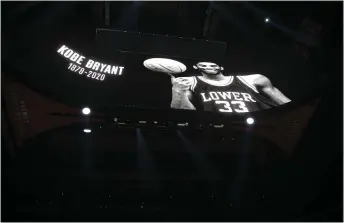  ?? THE ASSOCIATED PRESS ?? An image of Kobe Bryant from his time at Lower Merion High School is displayed before the Sixers’ game against the visiting Golden State Warriors at Wells Fargo Center Tuesday night.