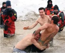  ?? GETTY IMAGES ?? Chicago’s annual Polar Plunge in March is for charity, not pain relief, but it regularly attracts celebritie­s like TV’s Jon Seda, center.