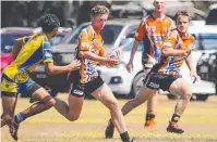  ?? Picture: LEA COGHLAN ?? RUN: Ravenshoe-Herberton's Justin Bevan in the Under 16s grand final against Malanda.