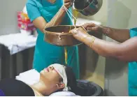  ??  ?? Ayurveda treatments include (from left) Shirodhara; and Ellakizhi, where a pouch containing leaves is applied with medicated oil to the body.