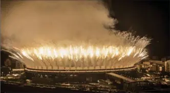  ?? BLOOMBERG NEWS FILE PHOTO ?? Fireworks explode over Maracana Stadium during the opening of the 2016 Olympic Games in Rio de Janeiro, Brazil, last Aug. 5.