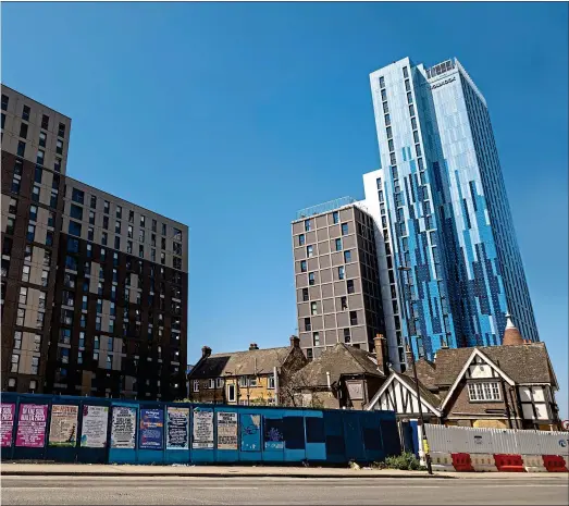  ?? ?? Last orders: the 1930s Castle pub, left, is being replaced by a 32-storey redbrick block, with towers being built off site