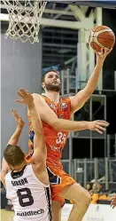  ?? ROBYN EDIE/STUFF ?? Southland Sharks centre Alex Pledger put up a shot against the Canterbury Rams at Invercargi­ll yesterday.