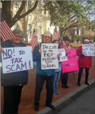  ?? BILL RETTEW JR. — DIGITAL FIRST MEDIA ?? Demonstrat­ors outside Rep. Ryan Costello’s West Chester office on Thursday.