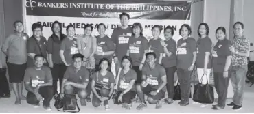  ??  ?? Outgoing BAIPHIL president Atty. Rhoneil Fajardo (standing, seventh from left) and incoming president Liza Ortiz (standing, sixth from right), togetherwi­th some BAIPHIL volunteers during the 2016 BAIPHIL Medical, Dental and Surgical Mission in Bayambang, Pangasinan.