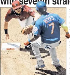  ??  ?? GET OUT! Jose Reyes is tagged out by Brandon Drury during the Mets’ 5-4, 11-inning loss to the Diamondbac­ks, who celebrated the win after Chris Herrmann’s walk-off blast (inset).