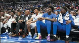  ?? KAREN PULFER FOCHT — THE ASSOCIATED PRESS ?? Memphis’ James Wiseman, second from right, watches the team’s game against Arkansas-Little Rock in Memphis, Tenn.