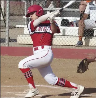  ?? KARINA LOPEZ PHOTO ?? Imperial High’s Patrick Bush follows through on a hit for the Tigers on Wednesday afternoon.