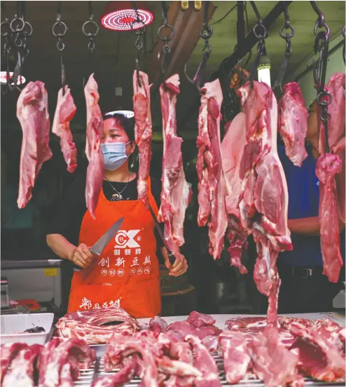  ?? HECTOR RETAMAL/AFP via Gett y Images files ?? Chinese experts say animals from the market in Wuhan — tested at the Chinese Centres for Disease Control and Prevention — were found not to contain the novel coronaviru­s.