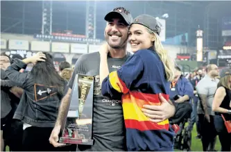  ?? RONALD MARTINEZ/GETTY IMAGES ?? Justin Verlander celebrates with Kate Upton after Game 7 of the ALCS. The rainbow jerseys that were mocked so much when the Houston Astros debuted them decades ago have now become fan favourites at Minute Maid Park.