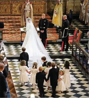  ?? Picture: Owen Humphreys/pool photo via AP ?? ELEGANCE: Meghan Markle during her wedding ceremony to Prince Harry at St George’s Chapel at Windsor Castle in Windsor on Saturday.