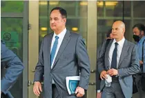  ?? AP PHOTO/MANUEL BALCE CENETA ?? Michael Sussmann, left, a cybersecur­ity lawyer who represente­d the Hillary Clinton presidenti­al campaign in 2016, leaves federal courthouse in Washington on May 16.