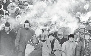  ?? AP PHOTO/FILE ?? Fans watch the host Green Bay Packers play the Dallas Cowboys in the 1967 NFL Championsh­ip Game 50 years ago today in Green Bay, Wis. It’s simply known as the “Ice Bowl.” The temp at kickoff was 13 below.