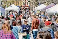  ?? Times Union archive ?? River Street is packed as the Troy Waterfront Farmers Market moves outdoors on May 5, 2018 in Troy. The farmers market is set to make its outdoor return for the season on Saturday.