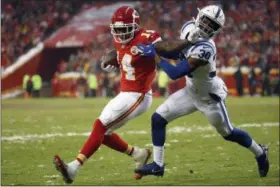  ?? CHARLIE RIEDEL - THE ASSOCIATED PRESS ?? Chiefs wide receiver Sammy Watkins is tackled by Colts defensive back George Odum during the first half of a divisional football playoff game in Kansas City on Jan. 12.