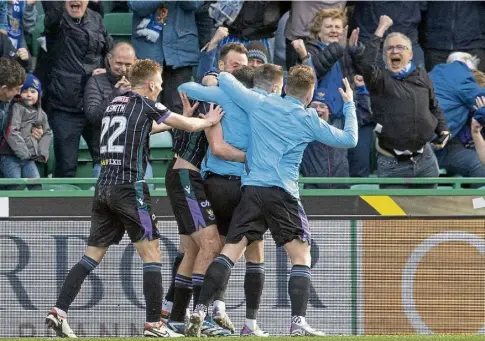  ?? ?? EASTER TREAT: St Johnstone’s Tony Gallacher celebrates scoring against Hibs with team-mates.