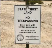  ?? PHOTO BY BLAKE HERZOG/YUMA SUN ?? ONE OF THE SIGNS posted along the west side of Avenue 15E in the Foothills, on the edge of a square mile of state land where dozens of RVs were camped this winter.