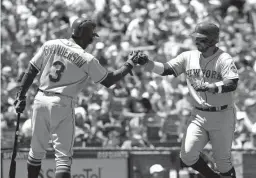  ?? Associated Press ?? New York Mets' Rene Rivera, right, is met at the plate by teammate Curtis Granderson after hitting a solo home run against the San Francisco Giants during the fourth inning of a baseball game Sunday in San Francisco.