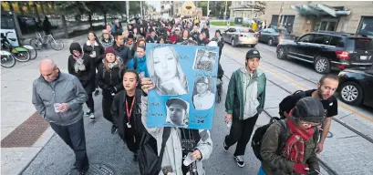  ?? STEVE RUSSELL TORONTO STAR ?? Safe-injection site advocates walk along Dundas St. E. on Monday at a vigil hosted by the Toronto Overdose Prevention Society.