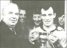  ??  ?? Pat Fox, the Askamore captain, receiving the trophy from Seán Browne, Co. Chairman, after they defeated St. Fintan’s by 4-4 to 1-11 in the Junior hurling championsh­ip final in Bellefield on December 7, 1969.