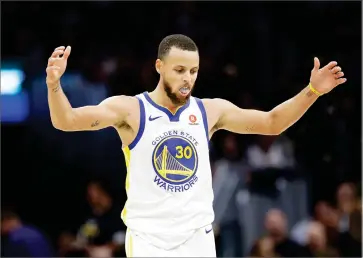  ?? AP PHOTO BY TONY DEJAK ?? Golden State Warriors’ Stephen Curry celebrates in the second half of Game 4 of basketball’s NBA Finals against the Cleveland Cavaliers, Friday, June 8, in Cleveland.