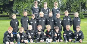  ??  ?? David Neave, of GTC Staffing Solutions, has sponsored the oldest and youngest Broughty United youth football teams with kit and jackets. Back — 2002 players. Front — the youngest 2011 Fun Fours.