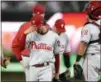  ?? NICK WASS — THE ASSOCIATED PRESS ?? Phillies pitcher Aaron Nola, left, walks back to the dugout after he was pulled from a game last Thursday in Washington.