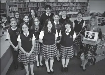  ?? LOANED PHOTO FROM ST. FRANCIS OF ASSISI CATHOLIC SCHOOL with her students that placed at this year’s SARSEF. ?? MARIANN SLATER (FAR RIGHT) SMILES