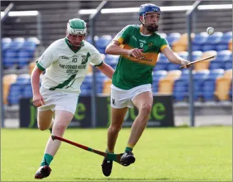  ??  ?? Eoin Keddy of Kilcoole is chased by Sean Somers of Arklow Rock Parnells.