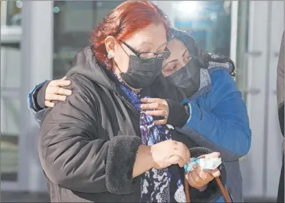  ?? Erik Verduzco Las Vegas Review-journal @Erik_verduzco ?? Juana Araiza, left, with her daughter Wendy, listen during a news conference on the homicide investigat­ion involving her son, Aldo Araiza Jr., who went missing in 2000 and whose remains were found in 2004. Police are looking for two persons of interest in the case.