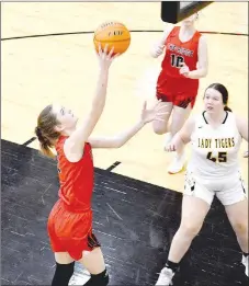  ??  ?? Pea Ridge senior Aiden Dayberry, No. 5, finishes a drive by scoring in the lane against Prairie Grove. Dayberry scored 9 points in the Lady Blackhawks’ 65-38 win in 4A-1 Conference girls basketball action at Tiger arena on Tuesday, Feb. 9.