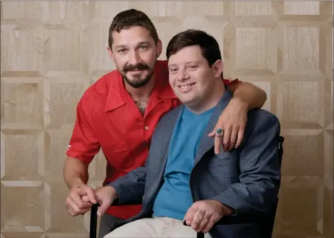  ?? AP PHOTO BY CHRIS PIZZELLO/INVISION ?? In this Friday, Aug. 2, 2019 photo, Shia Labeouf, left, and Zack Gottsagen, cast members in the film “The Peanut Butter Falcon,” pose together for a portrait at the London West Hollywood, in West Hollywood, Calif. The movie opens in the U.S. on Aug. 9.