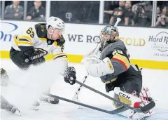  ?? AP ?? Bruins centre Brad Marchand, left, attempts a shot against Knights goaltender Marc-Andre Fleury.