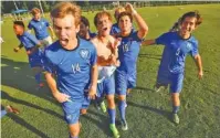  ?? STAFF PHOTO BY DOUG STRICKLAND ?? McCallie players celebrate their TSSAA Division II-AA state soccer tournament championsh­ip victory over MBA on Thursday.