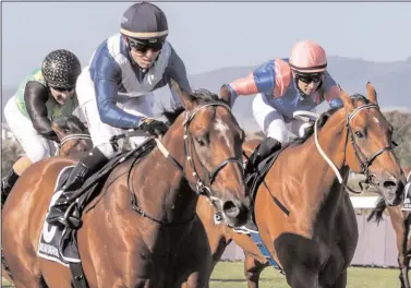  ?? Picture: Liesl King ?? WHISKY BARON (left) won the R5-million The Sun Met at Kenilworth on Saturday by one and a half lengths. Minor placings went to Legal Eagle, Captain America and Gold Standard. Greg Cheyne rode the winner for Brett Crawford.