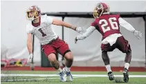  ?? NICK WASS THE CANADIAN PRESS FILE PHOTO ?? Vinny Papale (1) runs a drill against cornerback Tyler Green during an NFL rookie camp with Washington in 2019.