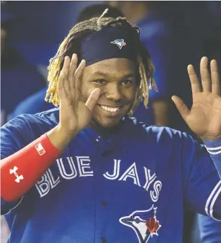  ?? FRED THORNHILL/THE CANADIAN PRESS ?? The Blue Jays’ Vladimir Guerrero Jr. is all smiles during his second major league game Saturday against Oakland. That cheery demeanour is much like that of his illustriou­s father, but unlike the free-swinging elder Guerrero, Vlad Jr. has shown judicious discipline at the plate.