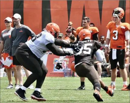  ?? PAUL DICICCO — FOR THE NEWS-HERALD ?? Defensive end Myles Garrett rushes off the edge as left tackle Greg Robinson blocks July 29 in Berea.