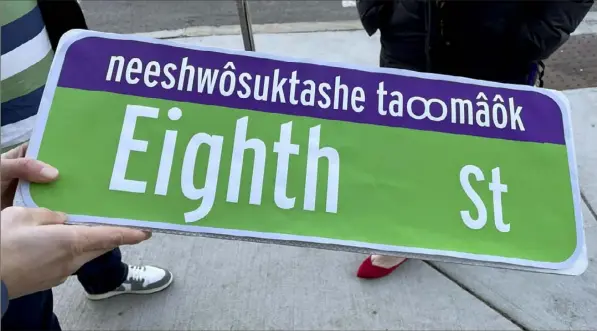  ?? Sarah Burks via AP ?? A paper mockup of the street signs that will go up next year in some parts of Cambridge, Mass., and include the language of the Massachuse­tt Tribe.